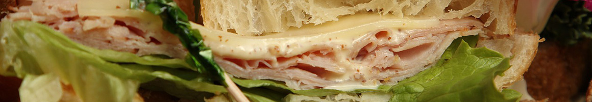 Eating Sandwich at Sandwich Works restaurant in Newton Centre, MA.